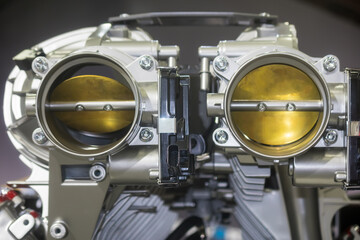 Shiny new automotive engine V4 Rear Throttle Body with cut section showing inside details.