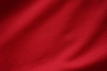 Close up of red football jersey sports clothing fabric texture.