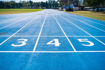 Bangkok, Thailand - December, 18, 2024 : Athletics Running Track with Blue Surface and White Lane Lines Designed for Competitive Use at Bangkok, Thailand.
