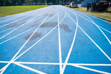 Bangkok, Thailand - December, 18, 2024 : Athletics Running Track with Blue Surface and White Lane Lines Designed for Competitive Use at Bangkok, Thailand.