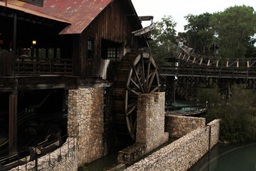 Fototapeta premium Historic water mill highlighted in Salou, Spain during a quiet afternoon surrounded by nature