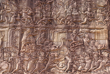 Mural bass-relief art in ancient temple Bayon Angkor complex, Cambodia