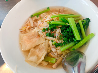  The aroma of the crab and spices wafts through the air, making the dish even more appetizing. 