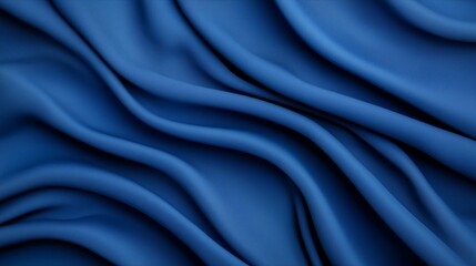 Fototapeta premium Textured blue fabric draping elegantly, showcasing rich color and intricate patterns, perfect for backgrounds or fashion design.