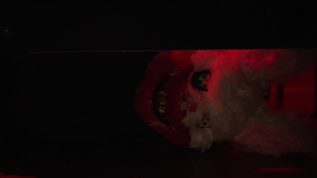 Terrifying Hooded Mask Caught in Flickering Lights: A Spine-Chilling Scene That Brings the Haunting Essence of Halloween to Life - Part 8.The monster looks under the bed.