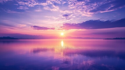 Obraz premium A peaceful morning landscape with the sun rising over a horizon, symbolizing new beginnings and motivation