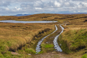 Scotland, Hebrides. Isle of Lewis, Aird Uig. Rutted dirt road to Loch a' Rubha Chaoil. Moorland.