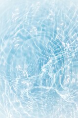 Bluewater waves on the surface ripples blurred. Defocus blurred transparent blue colored clear calm water surface texture with splash and bubbles. Water waves with shining pattern texture background.