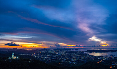aerial night view beautiful lighting around the Phuket big Buddha.  .Twinkling lights along the beach and in various towns around Phuket Island. .creative nature and travel concept.lighting 