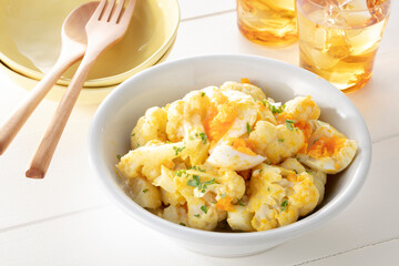 Curry salad with cauliflower and eggs. Curry salad cauliflower soup with egg topped