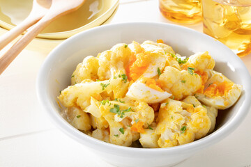 Curry salad with cauliflower and eggs. Curry salad cauliflower soup with egg topped