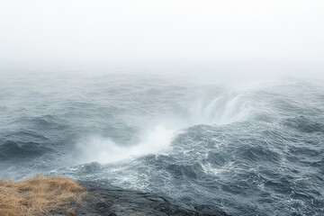 Fototapeta premium Dramatic Ocean Waves Crashing Against Foggy Shore