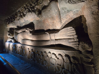 A carving of the Sleeping Buddha at Ajanta Caves