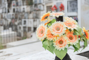 Bouquet of flowers in tombs in a cemetery