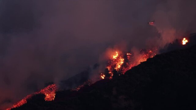 Los Angeles is currently facing severe wildfires in the nearby mountains, which are threatening numerous homes and necessitating urgent emergency aerial water drops for extensive firefighting efforts