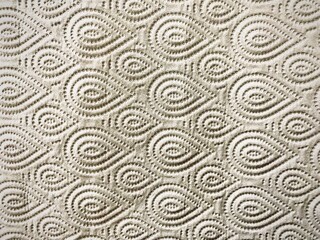 Luxurious textured pattern with embossed water drop art design on beige paper.