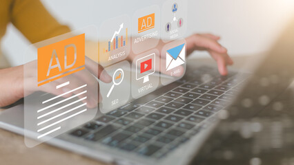 Women use laptops to advertise on websites. planning advertising marketing strategies to target...