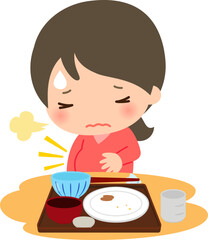 食事を完食後に食べ過ぎで苦しむ女性