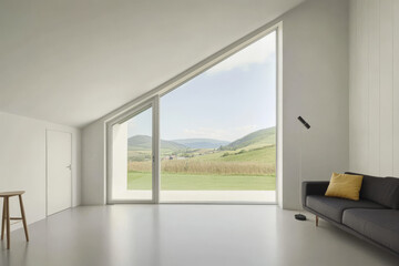 Modern living room with scenic hillside view through large angled windows