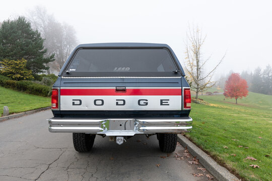 Portland, OR, USA - Nov 21, 2020 - 1992 Dark Blue Dodge Ram 250 LE Power Cummins Turbo Diesel 4x4 off-road American pickup truck SUV exterior. High quality picture for download