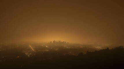 Obraz premium Smoggy Cityscape at Night: An Aerial View of Los Angeles Under an Orange Haze