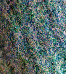 The image is of a fuzzy, green and blue texture