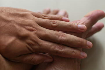 Fototapeta premium Close-Up of Hands Touching in a Friendly or Supportive Gesture