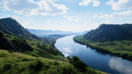 Serene river winding through lush green hills under a blue sky.