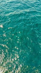 the natural texture of the sea surface exposed to sunlight, turquoise in color. photo taken close up. background, landscape