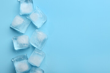 Many frozen ice cubes on blue background
