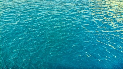 the natural texture of the sea surface exposed to sunlight, turquoise in color. photo taken close up. background, landscape