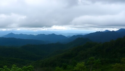 Breathtaking panoramic view of layered mountain forests under a cloudy sky in Mae Hong Son, Thailand, showcasing lush greenery and natural beauty