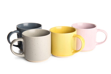 Different ceramic mugs isolated on white background