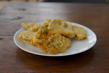 Mendoan Tempe with spicy sauce, Mendoan Tempe is a food made from Tempe fried with wheat flour