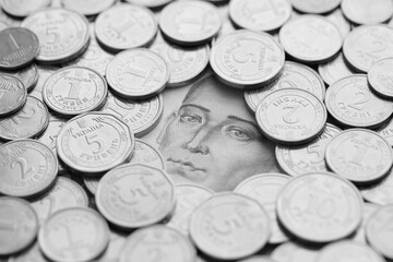 Grigory Skovoroda face from 500 Ukrainian Hryvnias money bill surrounded by silver ukrainian coins