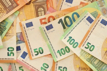 Pile of euro paper banknotes as finance background