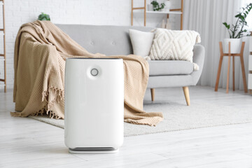 Modern air purifier in living room interior