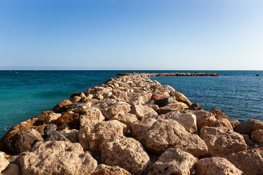 Riprap (rock armor) at the Mediterranean coast in Altea town in the Costa Blanca region of Spain.