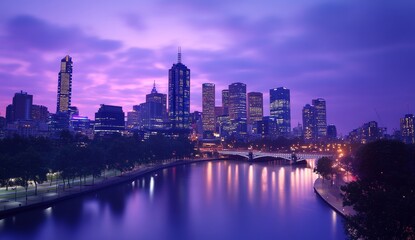 Obraz premium Cityscape at twilight, river reflections, urban skyline.