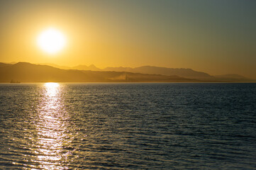 Sunrise over the beach and city in Malaga, Spain
