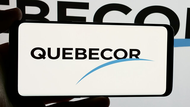 Stuttgart, Germany - 01-02-2024: Person holding smartphone with logo of Canadian telecommunications company Quebecor Inc. on screen. Focus on phone display.