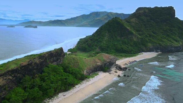Drone shot very high above mountain range at Capones Island, Pundaquit beach. Zambales, Philippines