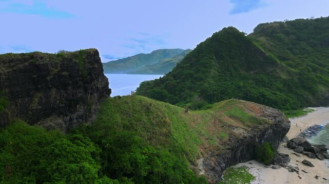 Aerial shot very high above mountain range at Capones Island, Pundaquit beach. Zambales, Philippines