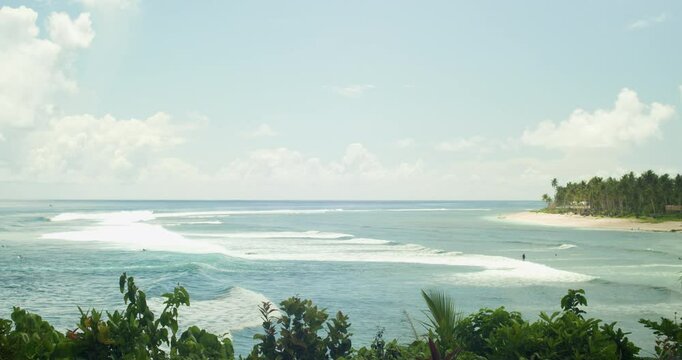 Time-lapse view of white sand beach on a surfing town in Siargao, Philippines.