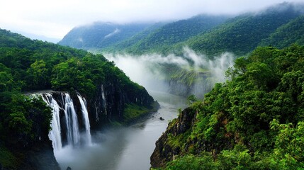 Fototapeta premium Misty Waterfall in Lush Jungle