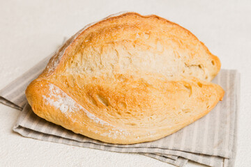 Fresh homemade crisp bread on napkin, top view. Healthy unleavened bread. French bread. Top view Bakery products