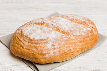 Fresh homemade crisp bread on napkin, top view. Healthy unleavened bread. French bread. Top view Bakery products