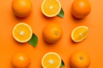 Fruit pattern of fresh orange slices on colored background. Top view. Copy Space. creative summer...