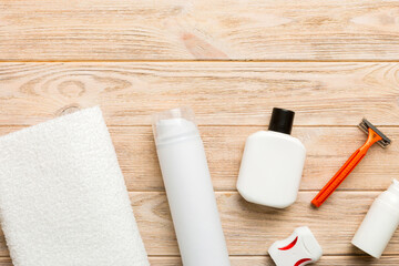Naklejka premium Composition with bath cosmetics on table. razor, toothpaste, soap, gel, toothbrush, mouthwash and other various accessories. Cosmetics for skin health. Bath Mockup for your logo