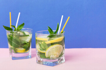 Mojito summer refreshing cocktail with ice and mint. mojito cocktail with lime, lemon and mint in a tall glass with a stick